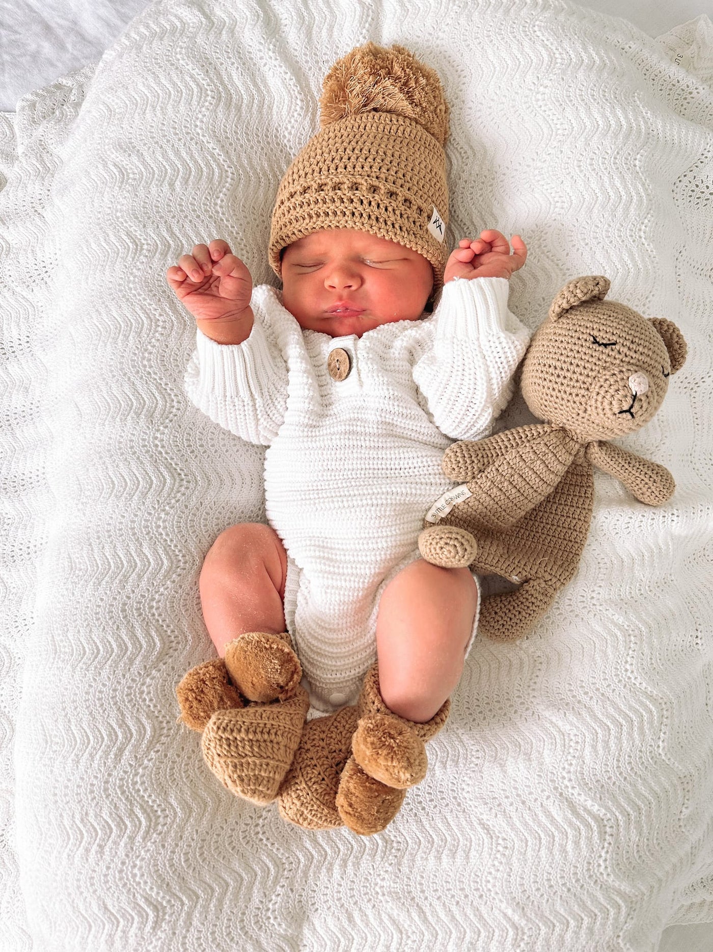 Baby Luna plush teddy bear in a shops hat and dress